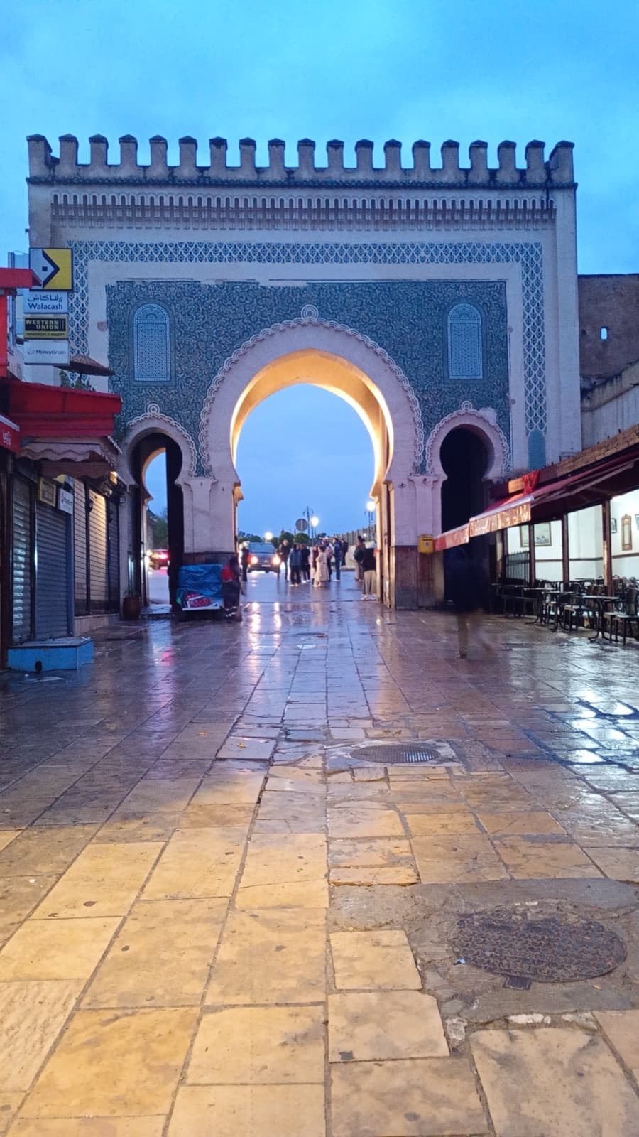 Bab Boujloud — the blue gate of Fez — at dusk.